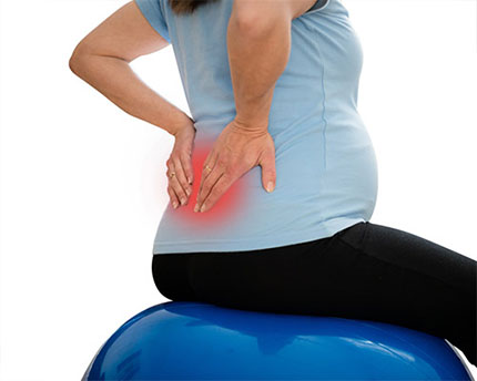 A pregnant woman experiencing lower back pain