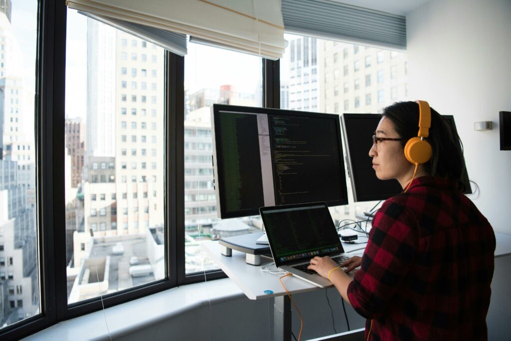 a woman working at an ergonomically designed standing desk